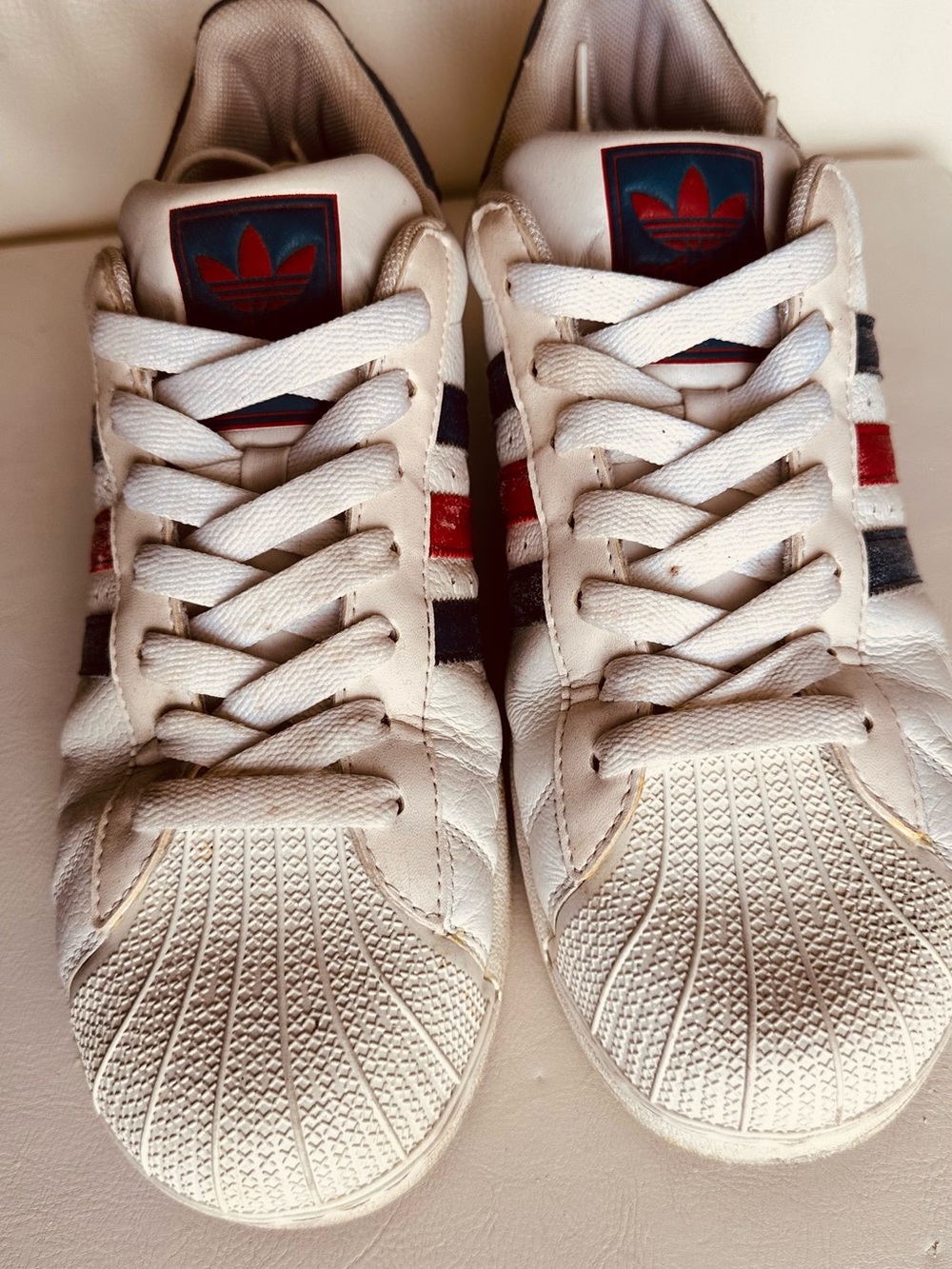 Adidas Original Superstar, shell toe, White Sneakers with Red & Navy Stripes.